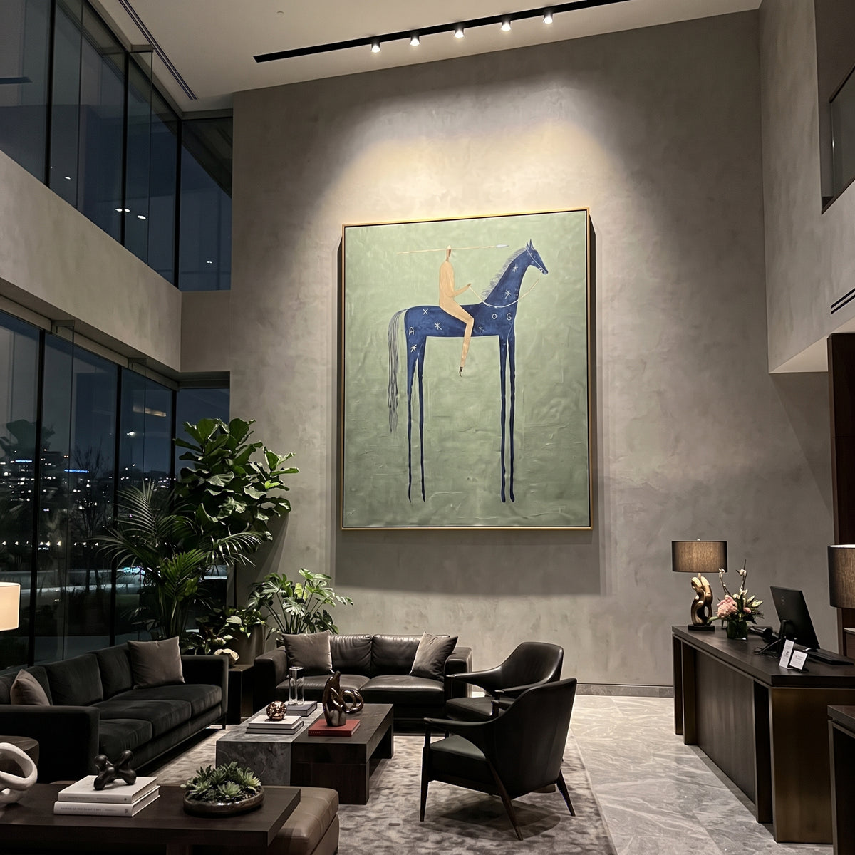 Blue Horse Sage Rider focuses on a blue horse with a small rider standing over a muted sage green ground, using the sage green family as the main atmosphere while keeping the subject and composition specific to the actual main image. The visible details are described from the artwork itself: the placement of the main forms, the surrounding negative space, the relationship between pale highlights and deeper green or dark accents, and the direction of the brushwork across the surface. Raised