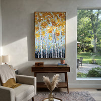 ARTWORK DETAILS Pale Gold Birch Cluster Painting is built from the actual artwork image: tall pale birches topped with soft golden leaves. The composition uses raised texture to separate tree trunks, leaf masses, ground movement, and soft background atmosphere, so the surface reads with real hand-painted depth from different viewing angles. The color direction is yellow, white, green, chosen to keep the autumn mood warm while still leaving enough pale air and cool contrast for modern interiors.