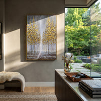 ARTWORK DETAILS Gold Sapling Reflection Painting is built from the actual artwork image: slender gold saplings reflected in gray water. The composition uses raised texture to separate tree trunks, leaf masses, ground movement, and soft background atmosphere, so the surface reads with real hand-painted depth from different viewing angles. The color direction is yellow, gray, white, chosen to keep the autumn mood warm while still leaving enough pale air and cool contrast for modern interiors. Core