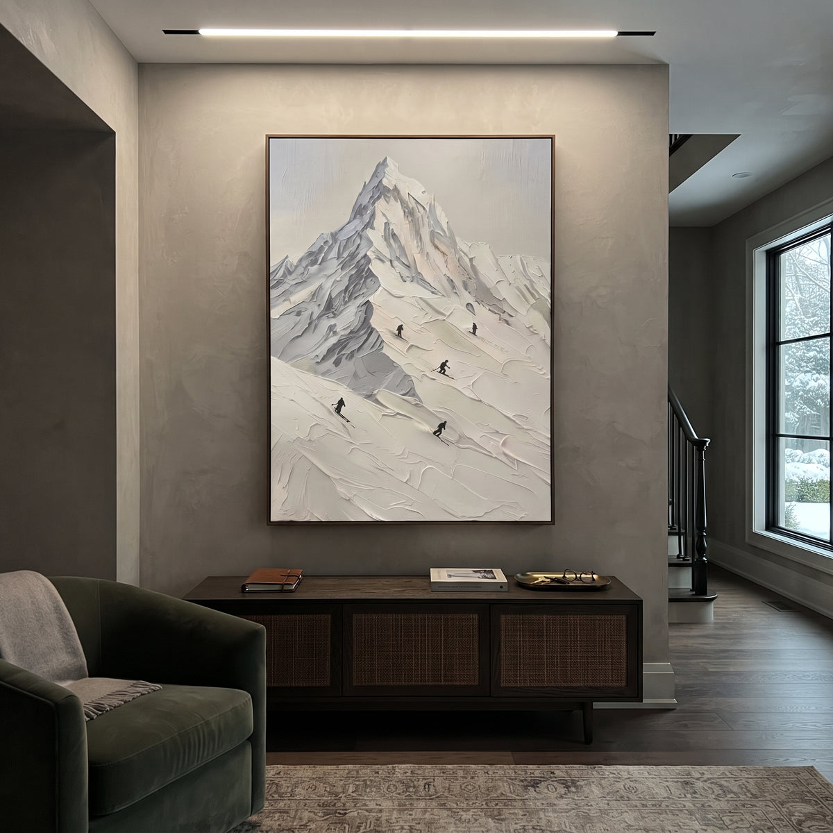 Skier Trail White Peak is written from the actual artwork image, focusing on skier trail white peak with black figures descending beneath a sharp summit. The visible composition is specific rather than generic: a sharp central peak, diagonal skier trail, small black figures, and smooth sculpted snowfields. The tall vertical layout controls how the eye travels through the scene, with the mountain mass, valley floor, tree line, water edge, or small figure details arranged to create depth across