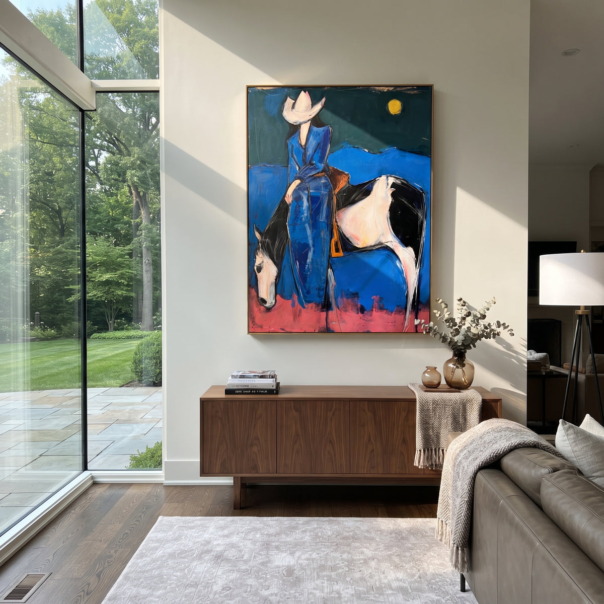 Midnight Blue Horse Rider is written from the actual artwork image, focusing on a blue-clad rider on a white horse beneath a moon over dark desert hills. The composition is built from specific visible details: white horse, blue rider clothing, crescent-like moon, dark hill line, pink ground, and night western mood. The vertical composition keeps attention on white horse, blue rider clothing, crescent-like moon, dark hill line, pink ground, and night western mood, using open ground, cropped