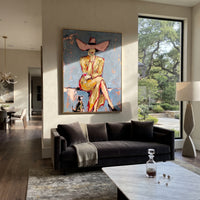 Pink Hat Dog Cowgirl is written from the actual artwork image, focusing on a seated pink-hat cowgirl with small black dog on a pale blue chair setting. The composition is built from specific visible details: large pink hat, small black dog, tan coat, pale blue chair, crossed legs, and quiet portrait pose. The vertical composition keeps attention on large pink hat, small black dog, tan coat, pale blue chair, crossed legs, and quiet portrait pose, using open ground, cropped edges, and strong color