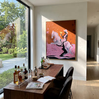 Martini Horse Ride is written from the actual artwork image, focusing on a cowgirl riding a white horse while holding a martini on an ochre field. The composition is built from specific visible details: white horse, raised martini, white hat, dark rider, ochre sky, and pink ground. The vertical composition keeps attention on white horse, raised martini, white hat, dark rider, ochre sky, and pink ground, using open ground, cropped edges, and strong color blocks to make the scene feel direct and