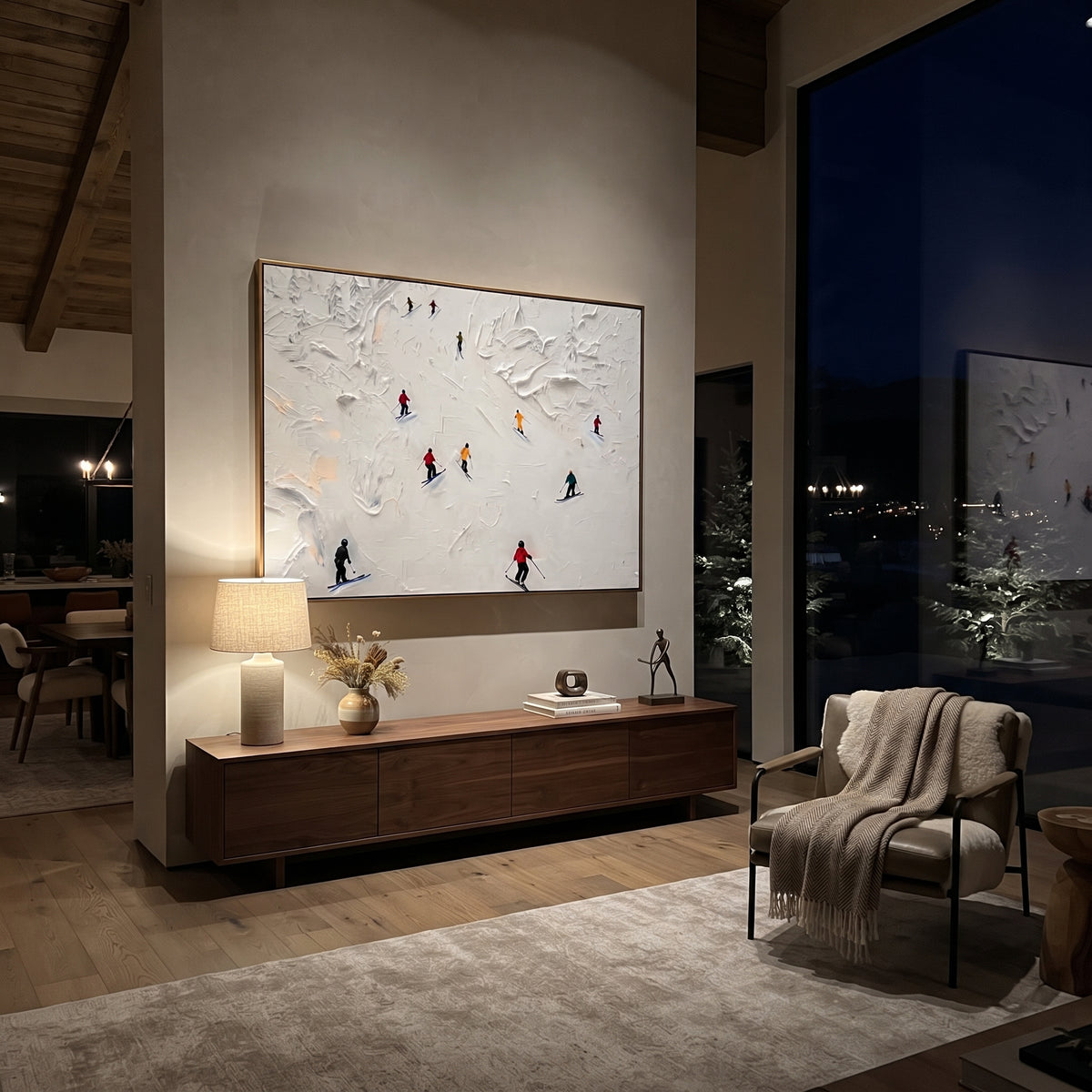 Summit Ski Valley focuses on soft gray snowfields broken by colorful skiers and thick ridge texture. The artwork shows a winter ski scene built from the actual image: visible downhill figures, curved snow tracks, raised ridgelines, and alpine space arranged in a wide composition. The blue, white, orange palette gives the piece a cold mountain atmosphere while the thick impasto surface creates shadows along each snowbank, ski line, and textured ridge. This is presented as hand-painted textured