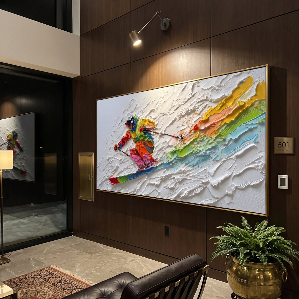 Rainbow Downhill Skier focuses on a close skier sweeping across thick white snow while rainbow bands trail behind the figure. The artwork shows a winter ski scene built from the actual image: visible downhill figures, curved snow tracks, raised ridgelines, and alpine space arranged in a wide composition. The white, green, red palette gives the piece a cold mountain atmosphere while the thick impasto surface creates shadows along each snowbank, ski line, and textured ridge. This is presented as