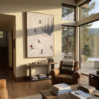 Trail Snow Corridors focuses on a forest-framed ski descent with clustered pines and winding carved tracks. The artwork shows a winter ski scene built from the actual image: visible downhill figures, curved snow tracks, raised ridgelines, and alpine space arranged in a tall composition. The white, blue, gray palette gives the piece a cold mountain atmosphere while the thick impasto surface creates shadows along each snowbank, ski line, and textured ridge. This is presented as hand-painted