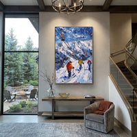 Chairlift Mountain Skiers focuses on orange ski lifts crossing a blue mountain slope with clustered skiers below. The artwork shows a winter ski scene built from the actual image: visible downhill figures, curved snow tracks, raised ridgelines, and alpine space arranged in a tall composition. The blue, white, orange palette gives the piece a cold mountain atmosphere while the thick impasto surface creates shadows along each snowbank, ski line, and textured ridge. This is presented as