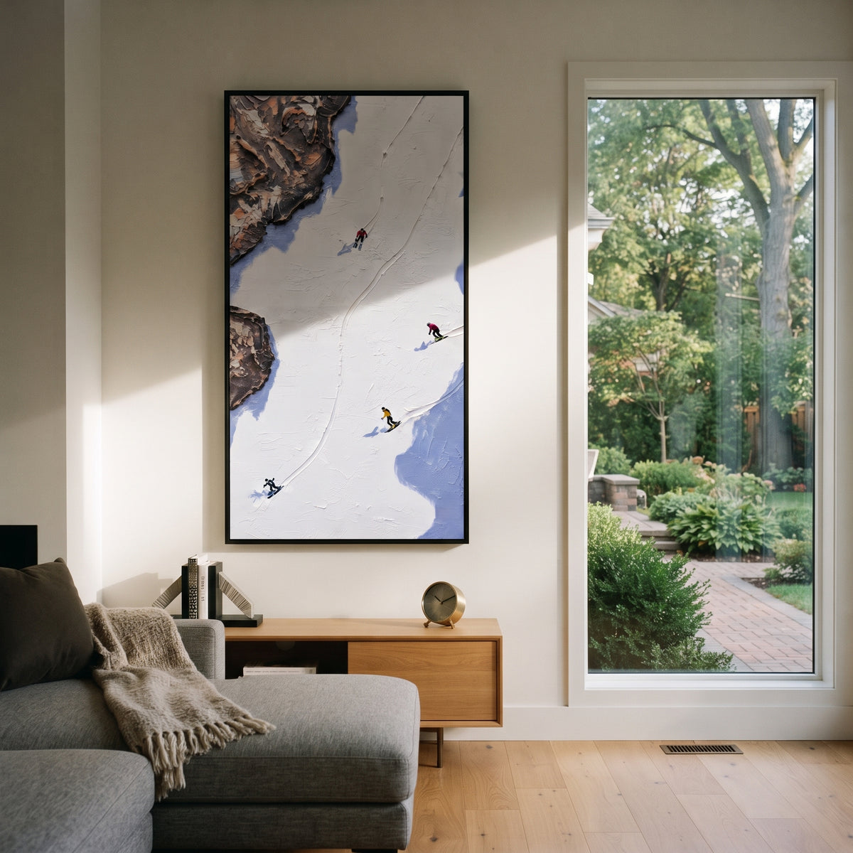 Summit Ski Valley With Pine Shadows focuses on soft gray snowfields broken by colorful skiers and thick ridge texture. The artwork shows a winter ski scene built from the actual image: visible downhill figures, curved snow tracks, raised ridgelines, and alpine space arranged in a tall composition. The white, gray, blue palette gives the piece a cold mountain atmosphere while the thick impasto surface creates shadows along each snowbank, ski line, and textured ridge. This is presented as