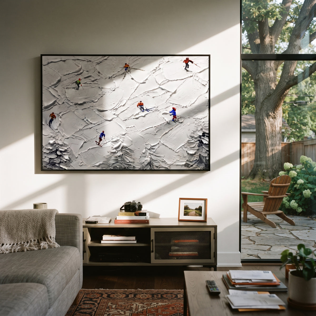 Peak Snow Basin focuses on layered snow ridges, visible ski marks, and a quiet pine border. The artwork shows a winter ski scene built from the actual image: visible downhill figures, curved snow tracks, raised ridgelines, and alpine space arranged in a wide composition. The white, gray, blue palette gives the piece a cold mountain atmosphere while the thick impasto surface creates shadows along each snowbank, ski line, and textured ridge. This is presented as hand-painted textured canvas rather