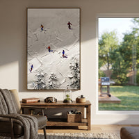 Silver Mountain Run With Blue Tracks focuses on a calm mountain basin with crisp tracks, snow shelves, and small skiers. The artwork shows a winter ski scene built from the actual image: visible downhill figures, curved snow tracks, raised ridgelines, and alpine space arranged in a tall composition. The blue, white, orange palette gives the piece a cold mountain atmosphere while the thick impasto surface creates shadows along each snowbank, ski line, and textured ridge. This is presented as