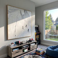 White Peak Three Skiers focuses on three dark skiers passing below a sharp raised white mountain face. The artwork shows a winter ski scene built from the actual image: visible downhill figures, curved snow tracks, raised ridgelines, and alpine space arranged in a balanced composition. The white, gray, black palette gives the piece a cold mountain atmosphere while the thick impasto surface creates shadows along each snowbank, ski line, and textured ridge. This is presented as hand-painted
