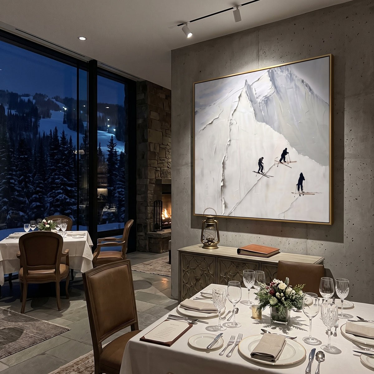 White Peak Three Skiers focuses on three dark skiers passing below a sharp raised white mountain face. The artwork shows a winter ski scene built from the actual image: visible downhill figures, curved snow tracks, raised ridgelines, and alpine space arranged in a balanced composition. The white, gray, black palette gives the piece a cold mountain atmosphere while the thick impasto surface creates shadows along each snowbank, ski line, and textured ridge. This is presented as hand-painted