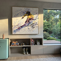 Yellow Jacket Carving Skier focuses on a yellow jacket skier leaning hard across violet and black speed marks. The artwork shows a winter ski scene built from the actual image: visible downhill figures, curved snow tracks, raised ridgelines, and alpine space arranged in a balanced composition. The yellow, purple, white palette gives the piece a cold mountain atmosphere while the thick impasto surface creates shadows along each snowbank, ski line, and textured ridge. This is presented as
