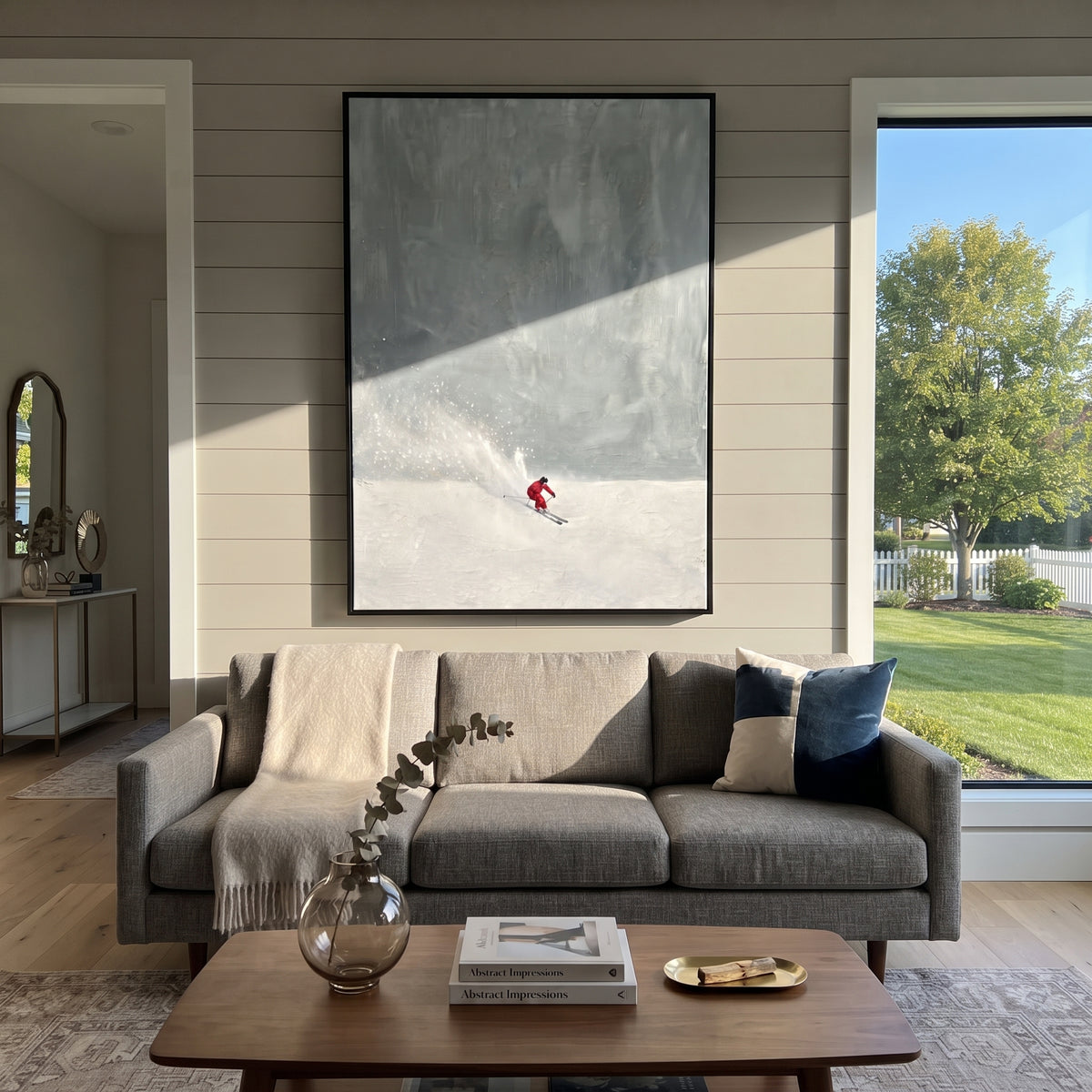 Red Skier Blue Mist focuses on a red skier crossing a low white slope beneath a broad blue misted sky. The artwork shows a winter ski scene built from the actual image: visible downhill figures, curved snow tracks, raised ridgelines, and alpine space arranged in a tall composition. The blue, white, red palette gives the piece a cold mountain atmosphere while the thick impasto surface creates shadows along each snowbank, ski line, and textured ridge. This is presented as hand-painted textured
