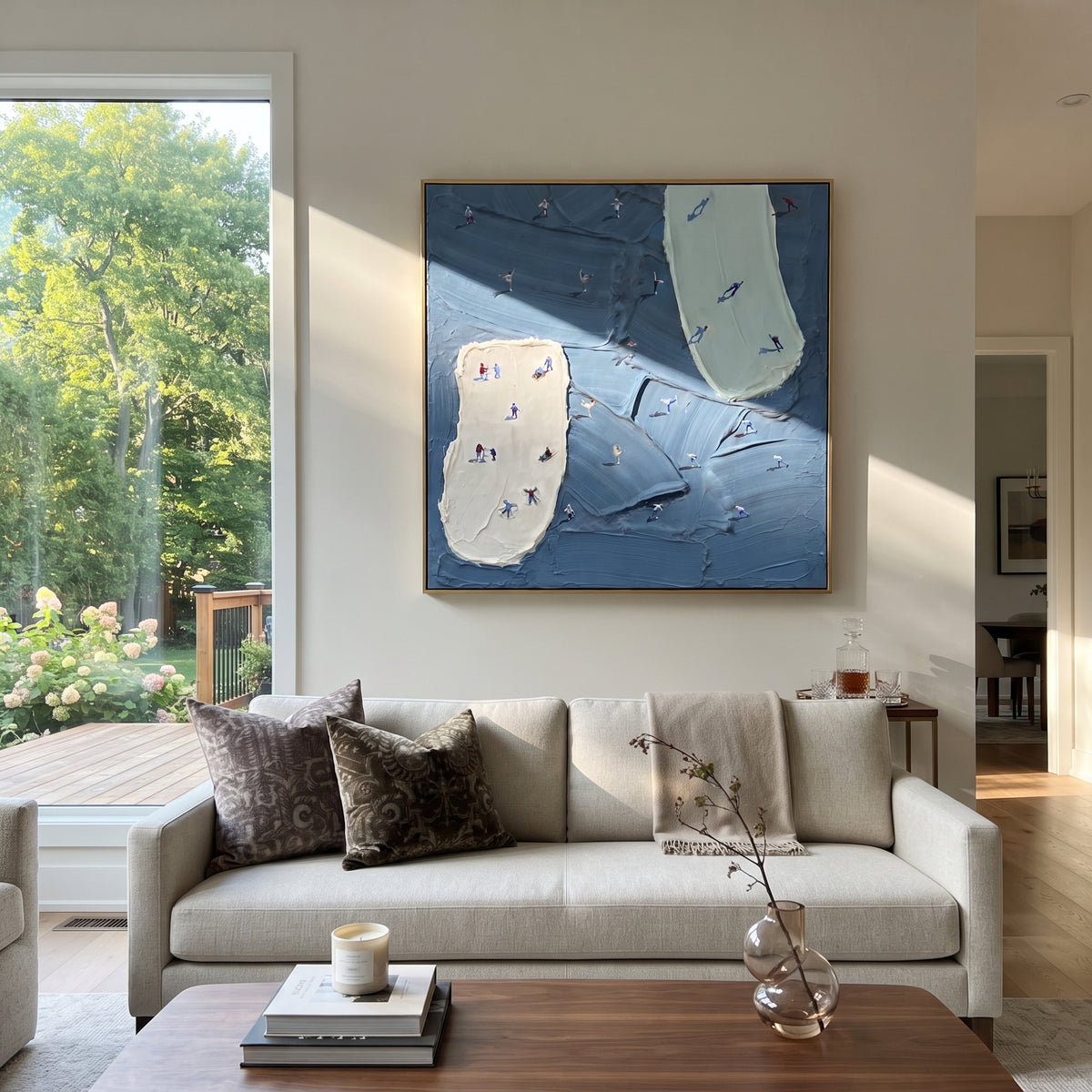 Blue Resort Island Trails focuses on tiny skiers scattered across blue resort trails divided by two pale raised ski islands. The artwork shows a winter ski scene built from the actual image: visible downhill figures, curved snow tracks, raised ridgelines, and alpine space arranged in a balanced composition. The blue, white, gray palette gives the piece a cold mountain atmosphere while the thick impasto surface creates shadows along each snowbank, ski line, and textured ridge. This is presented