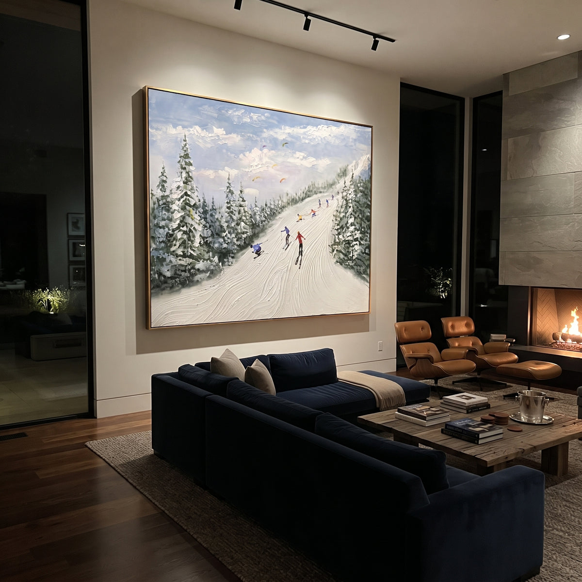 Green Pine Resort Run focuses on skiers descending a pale resort run bordered by green pines and distant mountains. The artwork shows a winter ski scene built from the actual image: visible downhill figures, curved snow tracks, raised ridgelines, and alpine space arranged in a wide composition. The green, white, blue palette gives the piece a cold mountain atmosphere while the thick impasto surface creates shadows along each snowbank, ski line, and textured ridge. This is presented as
