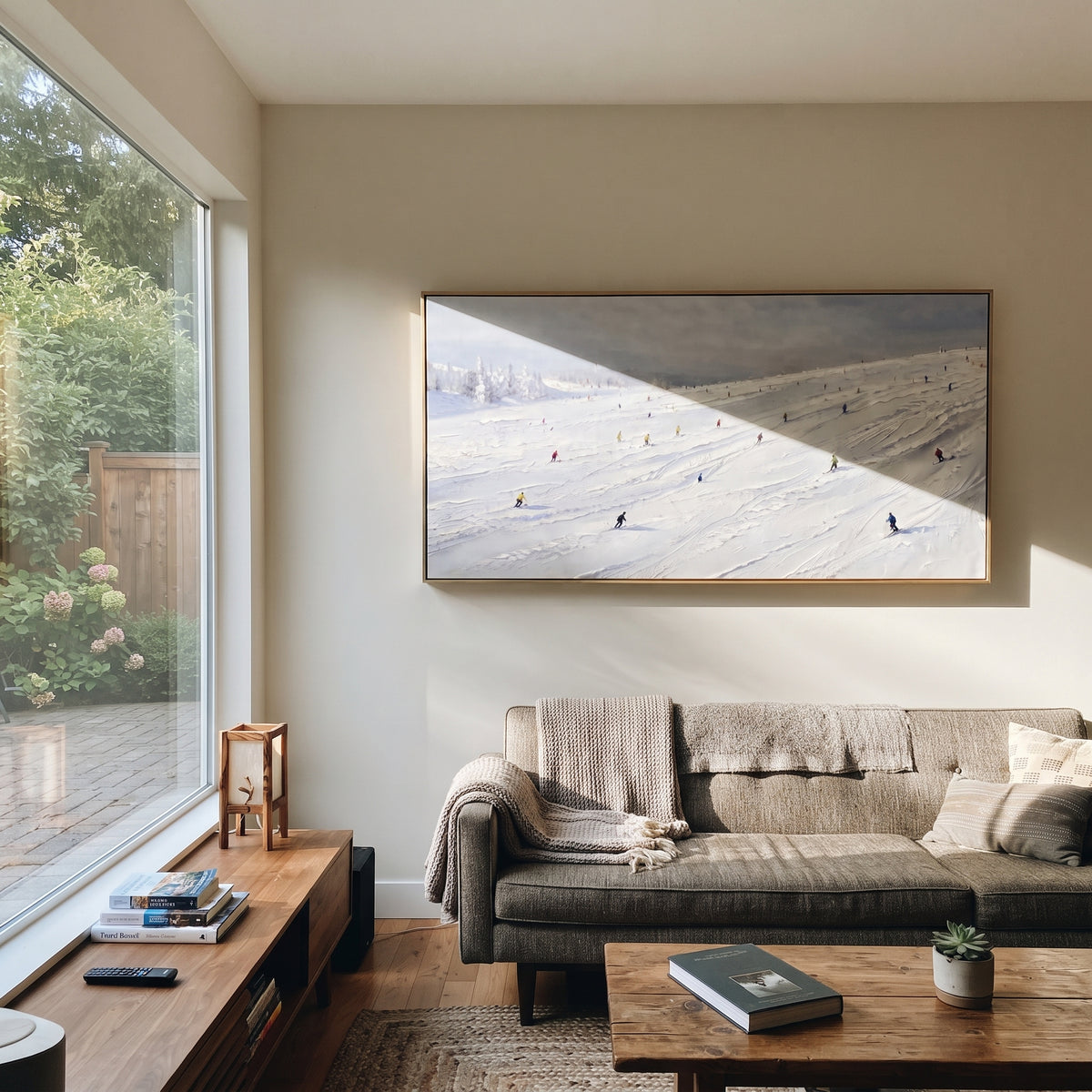 Snowfield Skiers With Distant Peaks focuses on colored skiers crossing raised white snow tracks between dark pine edges. The artwork shows a winter ski scene built from the actual image: visible downhill figures, curved snow tracks, raised ridgelines, and alpine space arranged in a wide composition. The white, beige, blue palette gives the piece a cold mountain atmosphere while the thick impasto surface creates shadows along each snowbank, ski line, and textured ridge. This is presented as