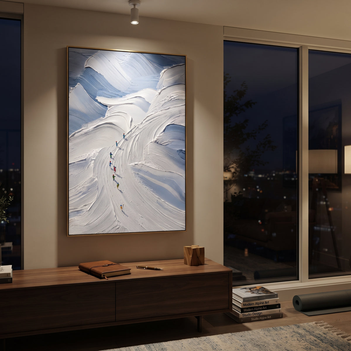 Pine Texture Run With Blue Tracks focuses on a calm mountain basin with crisp tracks, snow shelves, and small skiers. The artwork shows a winter ski scene built from the actual image: visible downhill figures, curved snow tracks, raised ridgelines, and alpine space arranged in a tall composition. The white, gray, blue palette gives the piece a cold mountain atmosphere while the thick impasto surface creates shadows along each snowbank, ski line, and textured ridge. This is presented as