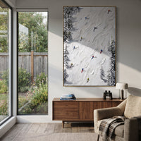 Crisp Winter Slope focuses on a forest-framed ski descent with clustered pines and winding carved tracks. The artwork shows a winter ski scene built from the actual image: visible downhill figures, curved snow tracks, raised ridgelines, and alpine space arranged in a tall composition. The white, green, blue palette gives the piece a cold mountain atmosphere while the thick impasto surface creates shadows along each snowbank, ski line, and textured ridge. This is presented as hand-painted