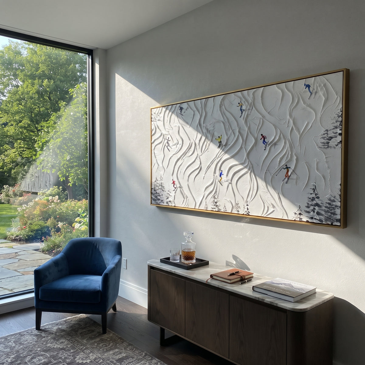 Winter Sunset Forest Skiers focuses on skiers passing through bare winter trees under a soft orange sunset. The artwork shows a winter ski scene built from the actual image: visible downhill figures, curved snow tracks, raised ridgelines, and alpine space arranged in a wide composition. The orange, blue, white palette gives the piece a cold mountain atmosphere while the thick impasto surface creates shadows along each snowbank, ski line, and textured ridge. This is presented as hand-painted