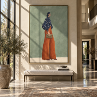 Navy Star Blouse Clutch focuses on the specific fashion figure shown in the artwork: woman in a navy star-pattern blouse and rust trousers holding a soft clutch. The image is built around elongated trousers, a compact upper-body pose, sculptural sleeve volume, small accessory detail, and a quiet studio background. The blue, brown, green palette keeps the mood refined while the raised texture and visible brushwork make the surface feel handmade rather than printed. This made-to-order canvas suits