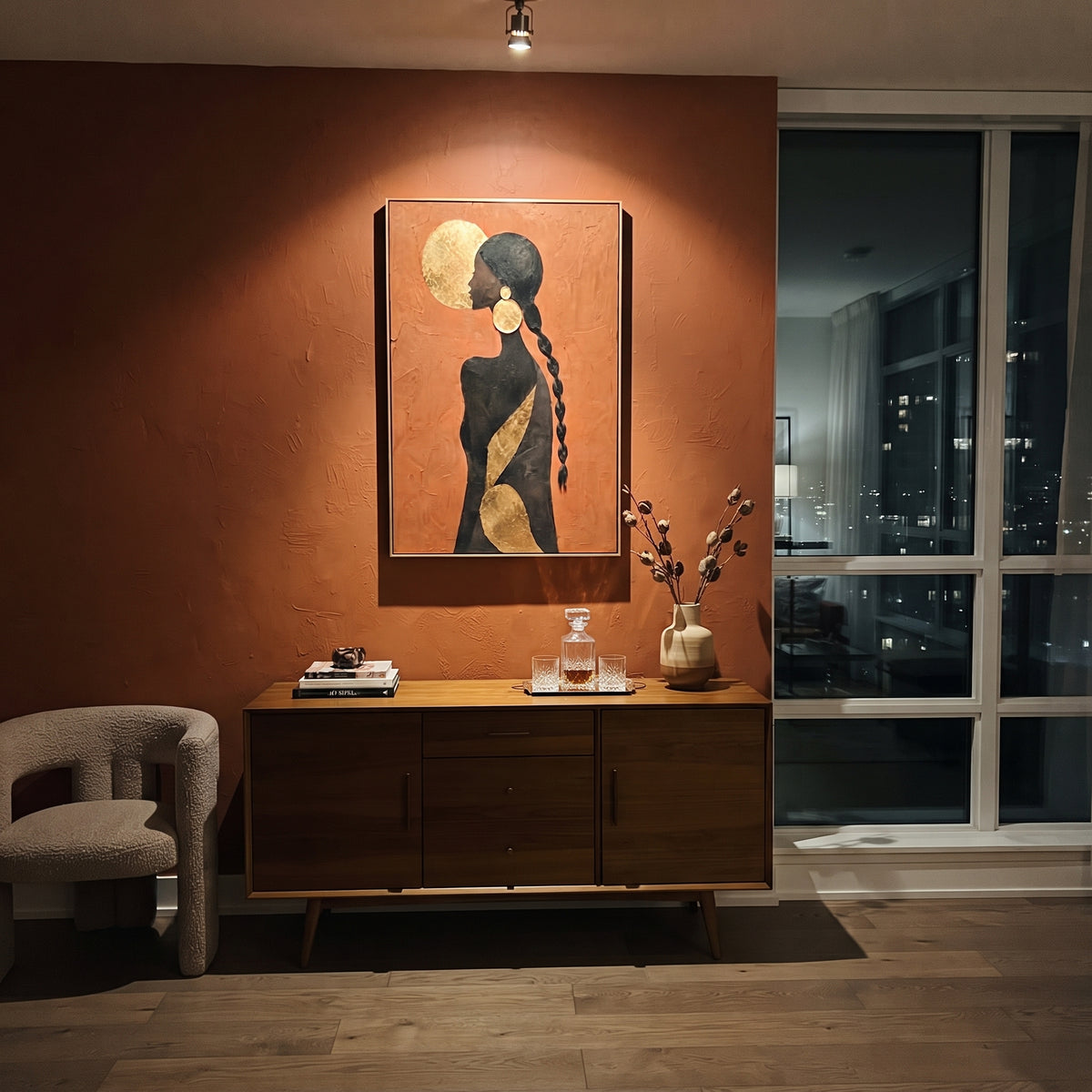 Gold Moon Braid Back focuses on back view black female silhouette with braid, gold moon disc, and bronze diagonal accent. The composition is built from the exact pose, clothing shape, accessories, furniture, animal form, shoreline, palm shape, surfboard, or table arrangement visible in this artwork, so the image reads as a specific modern figurative painting rather than a generic decorative abstract. The orange; black; gold palette gives the piece its main atmosphere, while smaller dark and