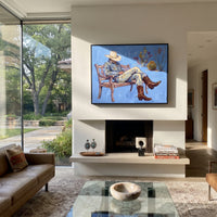 Storybook Cobalt Seated Western Rider focuses on a relaxed western figure in a broad hat seated in a chair. The composition keeps the principal subject clearly separated from the painted field, so the eye can follow the specific gesture, silhouette, garment, fur, petal, ridge, or river visible in this artwork. Its color relationships move between purple, green, and white, with lighter passages opening the focal area and deeper strokes giving the forms weight. Palette-knife edges, impasto ridges