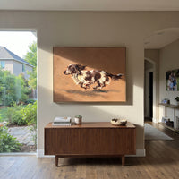 Restful Restful Running Spaniel focuses on a lively spaniel captured mid-stride with a lifted tail. The composition keeps the principal subject clearly separated from the painted field, so the eye can follow the specific gesture, silhouette, garment, fur, petal, ridge, or river visible in this artwork. Its color relationships move between green, grey, and pink, with lighter passages opening the focal area and deeper strokes giving the forms weight. Palette-knife edges, impasto ridges, broken