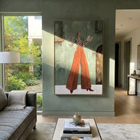 Soft Warm Wide-Legged Fashion Figure focuses on a stylized fashion figure in dramatic trousers, blouse, or patterned coat. The composition keeps the principal subject clearly separated from the painted field, so the eye can follow the specific gesture, silhouette, garment, fur, petal, ridge, or river visible in this artwork. Its color relationships move between blue, red, and white, with lighter passages opening the focal area and deeper strokes giving the forms weight. Palette-knife edges